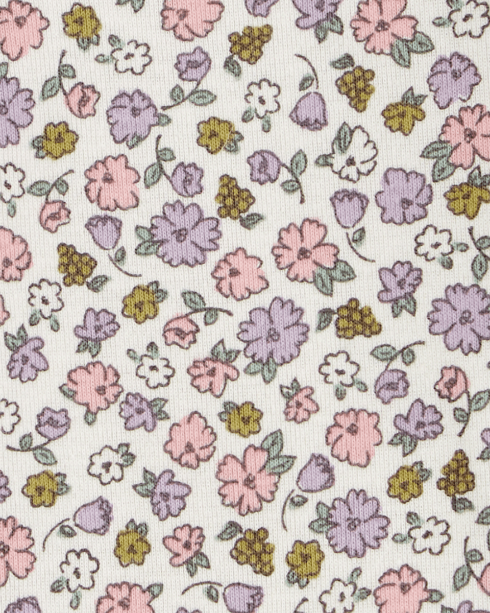 Conjunto tres piezas con dos bodies de algodón y calza con volantes, diseño floral