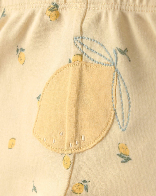 Conjunto tres piezas de algodón con dos bodies y pantalón, diseño limones