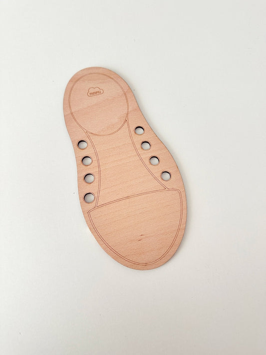 Zapato de madera para practicar atar cordones