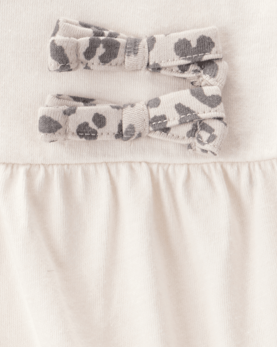 Conjunto 2 piezas con body de lazos y pantalón leopardo