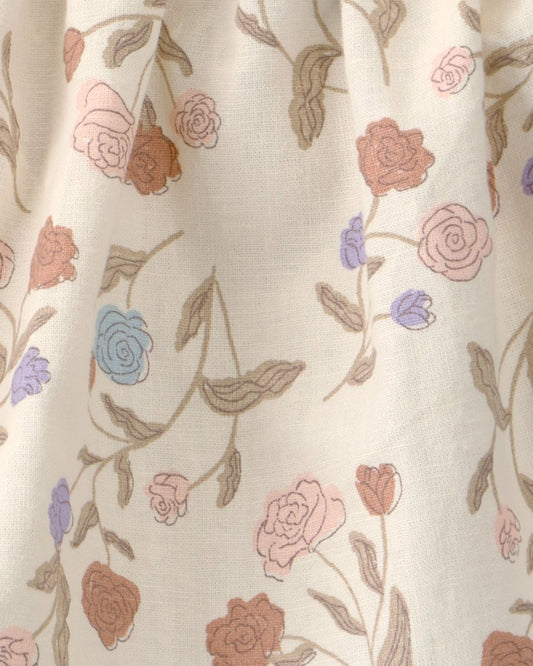 Conjunto tres piezas blusa y cubrepañal con lazo de lino y algodón, diseño floral