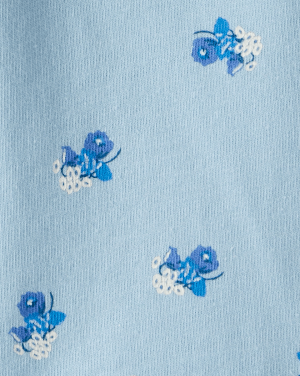 Conjunto tres piezas chaqueta de borreguito, body y pantalón floral azul
