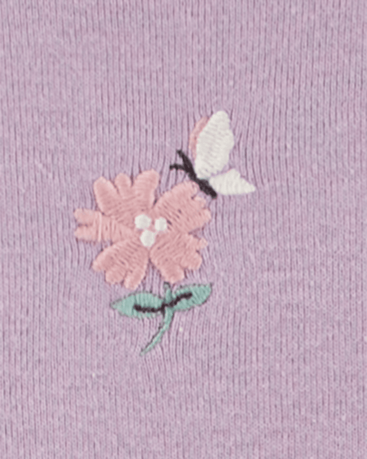 Conjunto tres piezas con dos bodies de algodón y calza con volantes, diseño floral