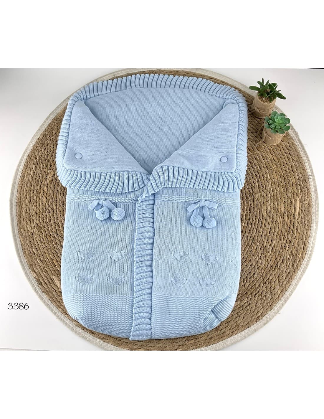 Saco de lana para bebé con pompones decorativos 521103386