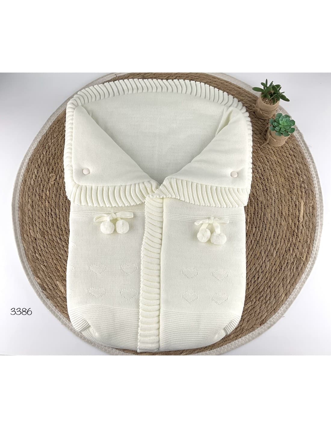 Saco de lana para bebé con pompones decorativos 521103386